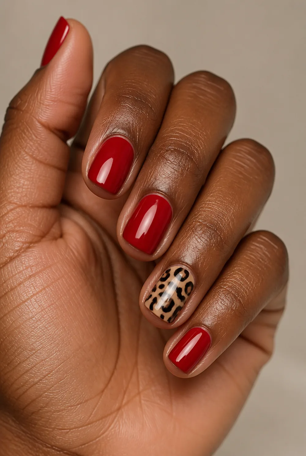 red with leopard accent nail art on deep brown skin - PolishedAndPrettyNails.com red with leopard accent nail art on deep brown skin