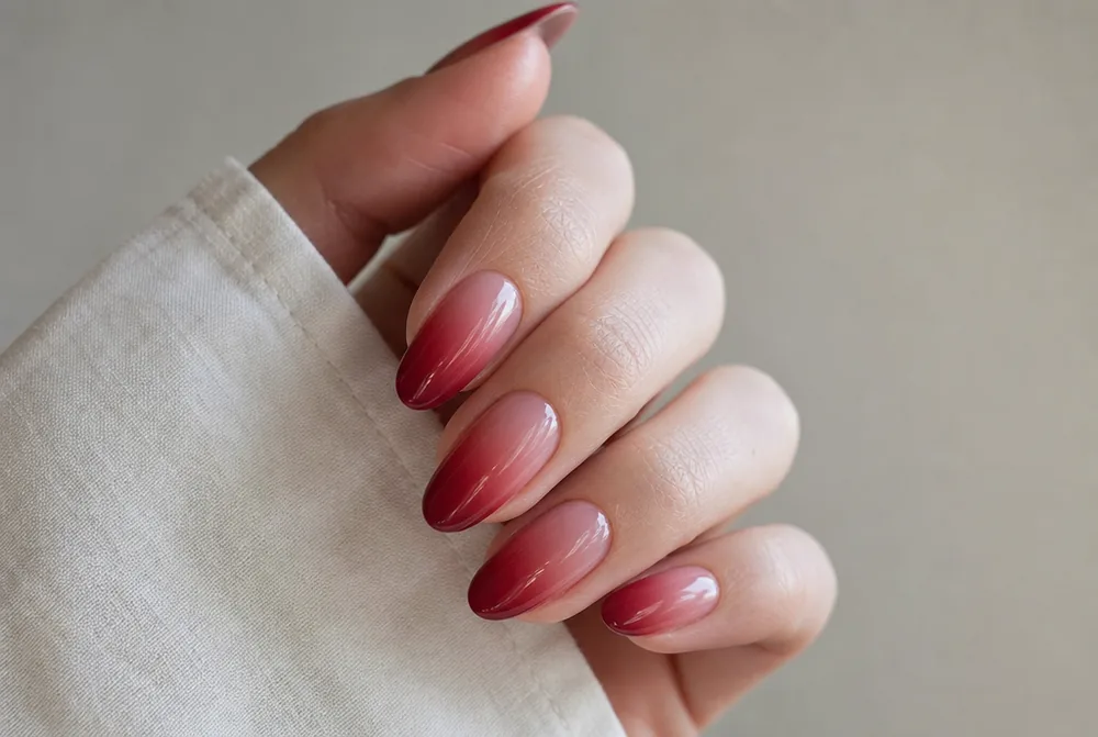 red ombre nails fading from nude to deep red