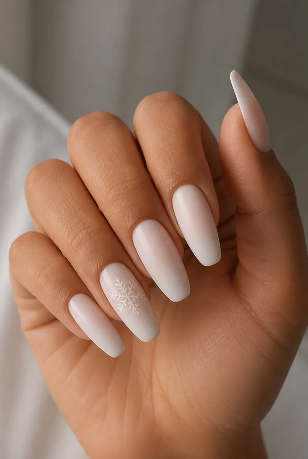 single white flake on milky base nail art on olive skin, long length