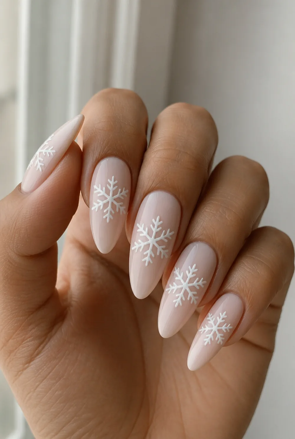 snowflake stamping nail art on olive skin, long length