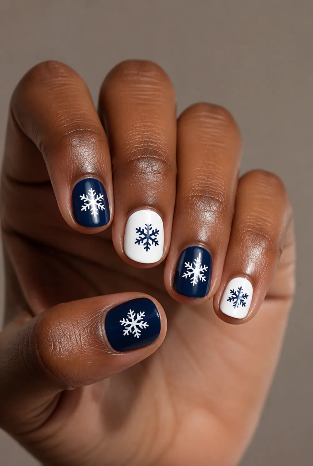 two-tone flake set nail art on deep brown skin