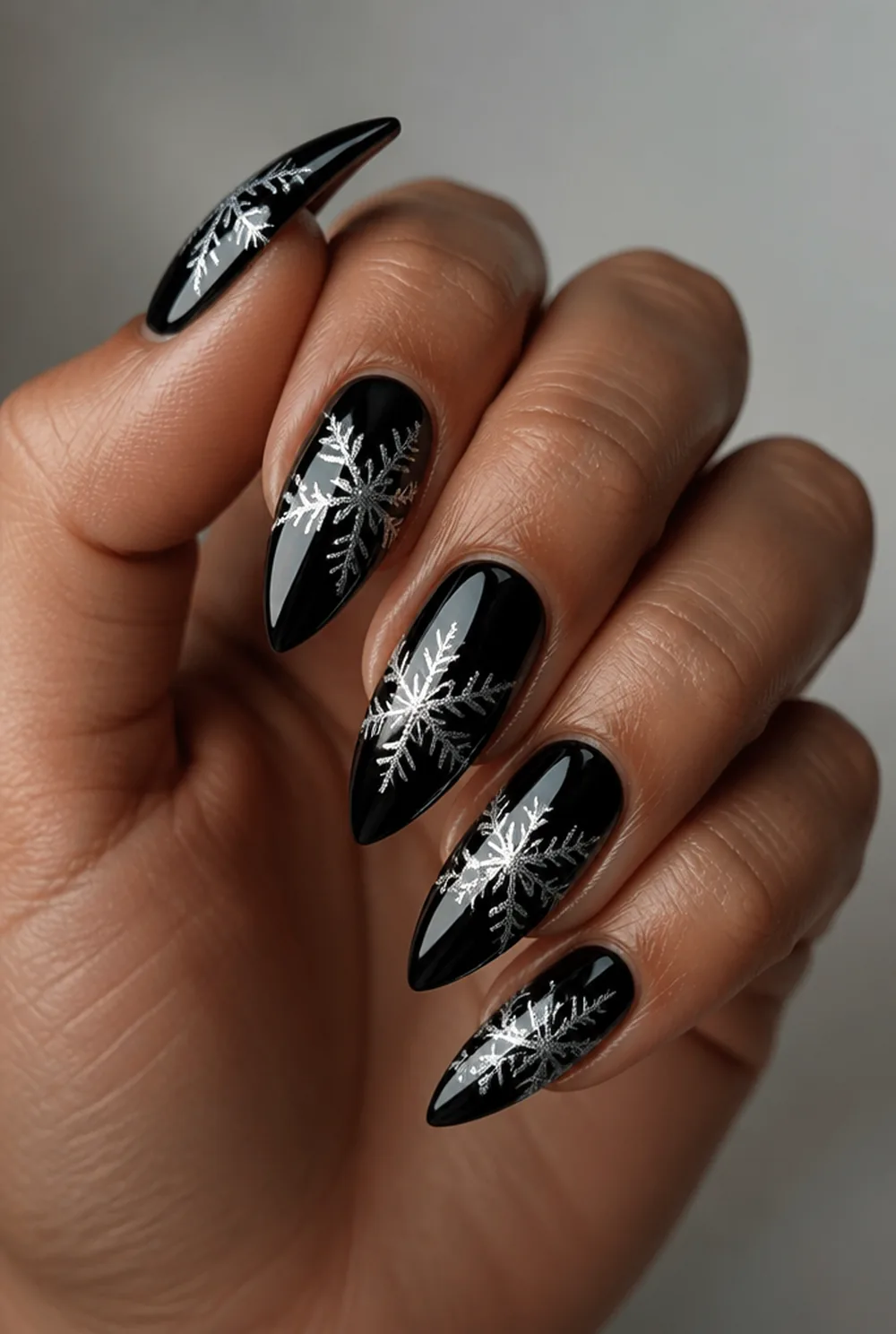 silver flake on black nail art on olive skin, long length