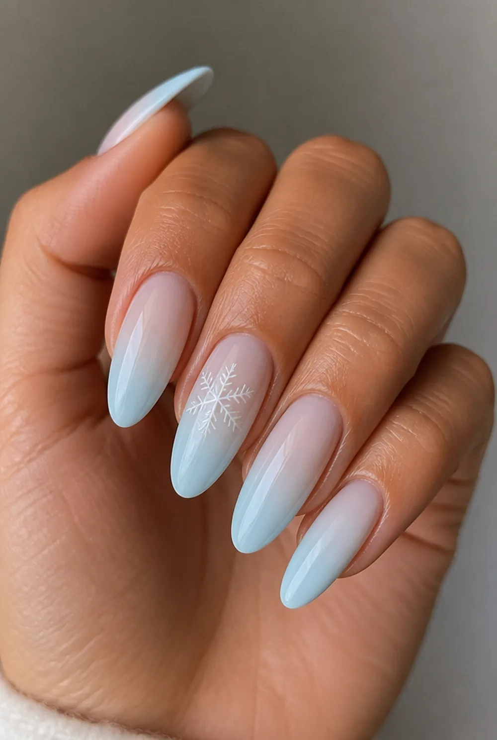 blue ombre with flakes nail art on olive skin, long length