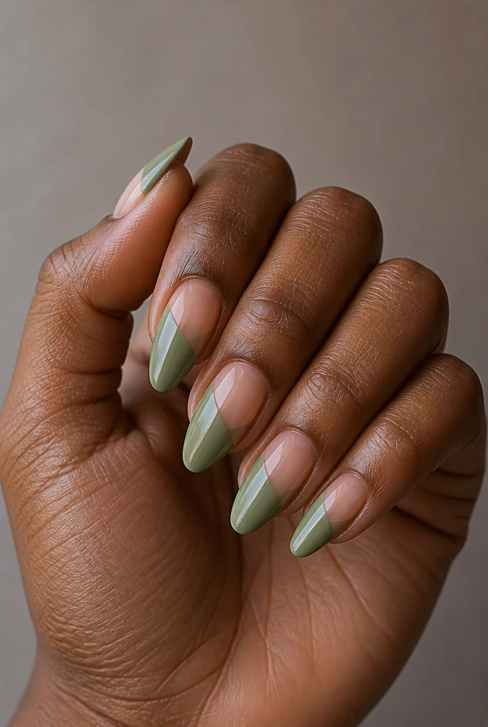 negative space stiletto nail art on deep brown skin