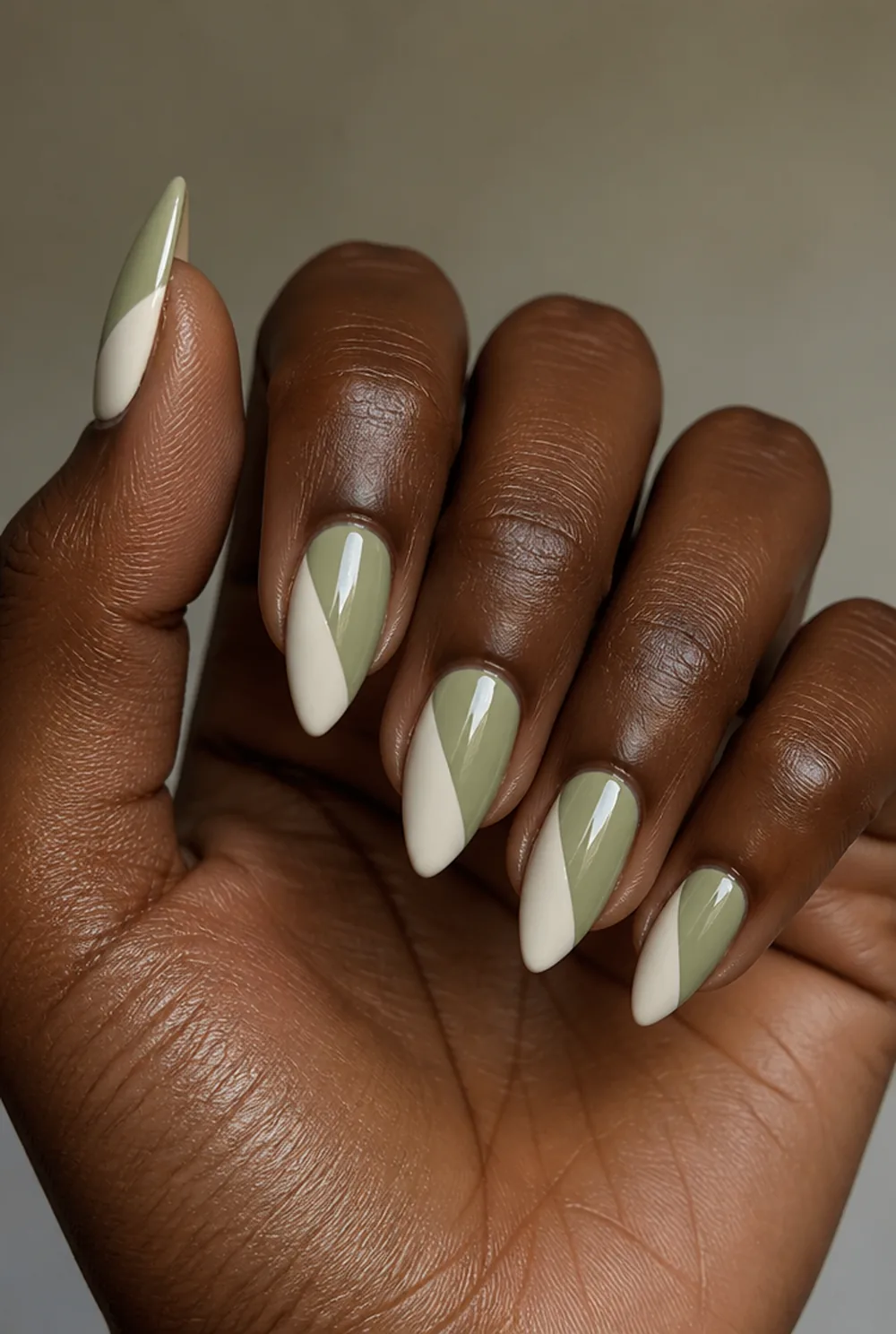 two-tone stiletto nail art on deep brown skin