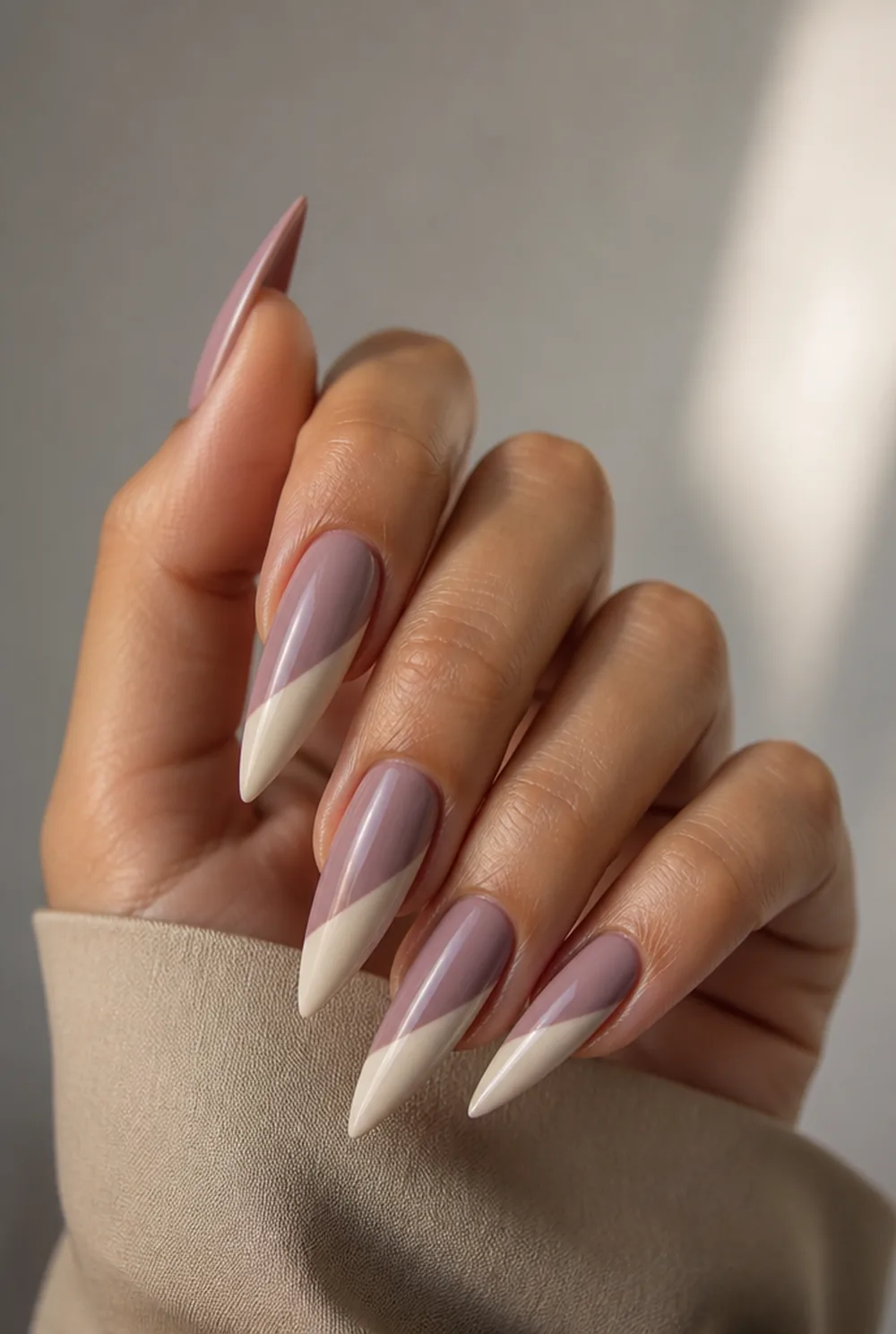 two-tone stiletto nail art on olive skin, long length
