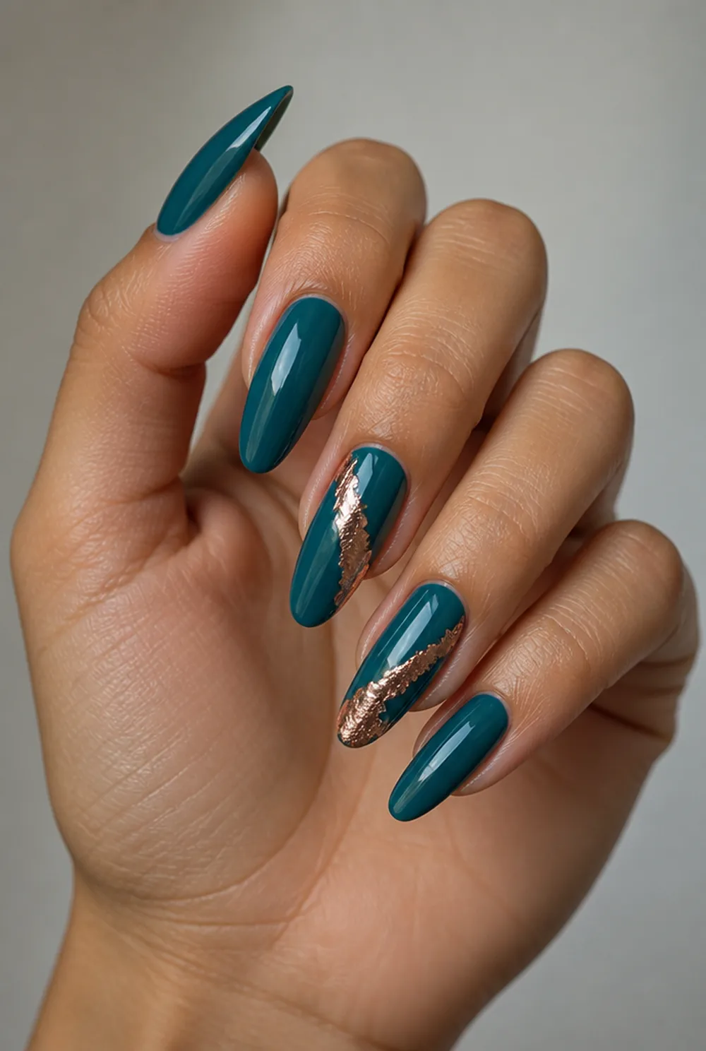 teal and copper nail art on olive skin, long length
