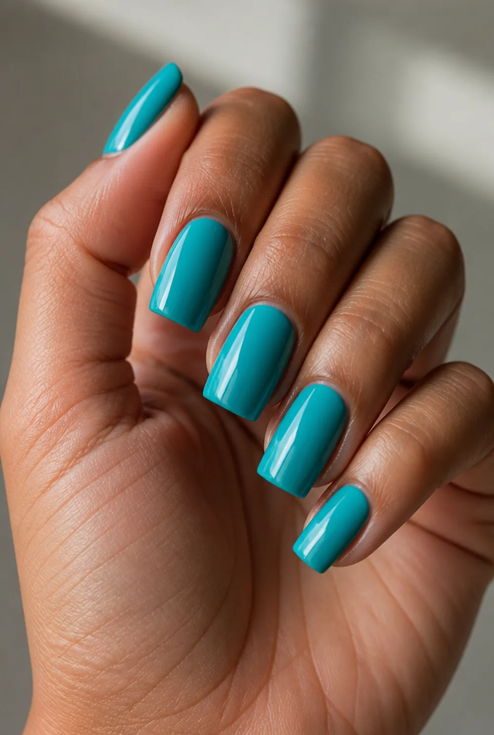 turquoise nail art on olive skin, long length