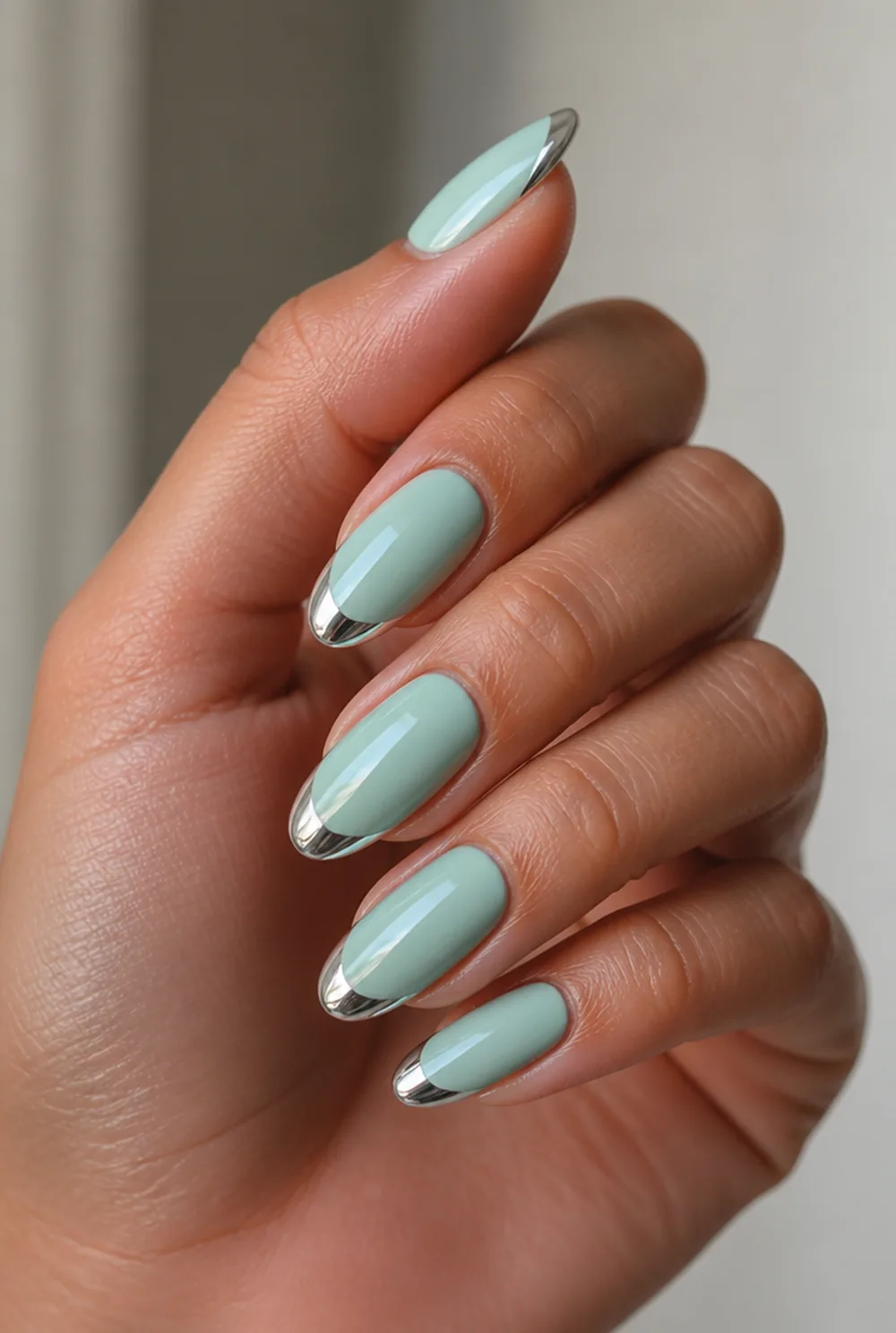 teal with chrome tips nail art on olive skin, long length