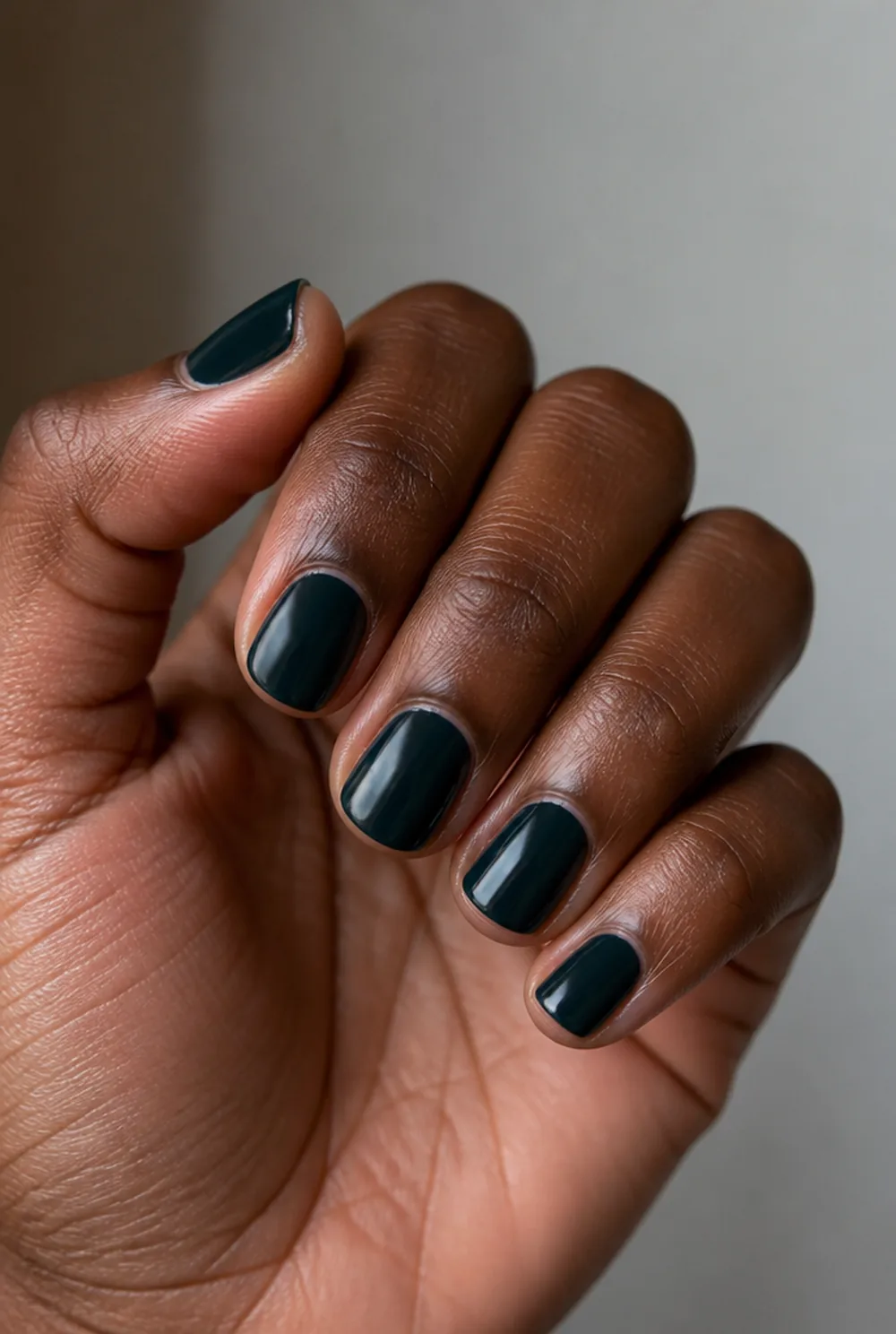 petrol nail art on deep brown skin