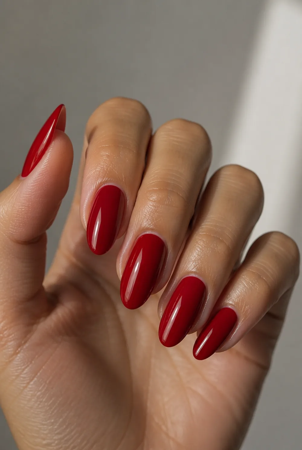 cherry red nail art on olive skin, long length