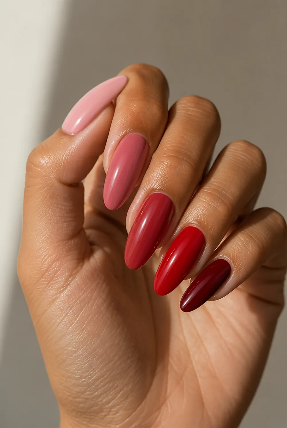 pink and red skittle nail art on olive skin, long length