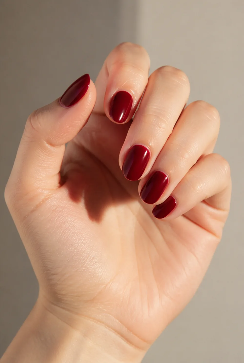 long red almond nail art on fair skin, short length