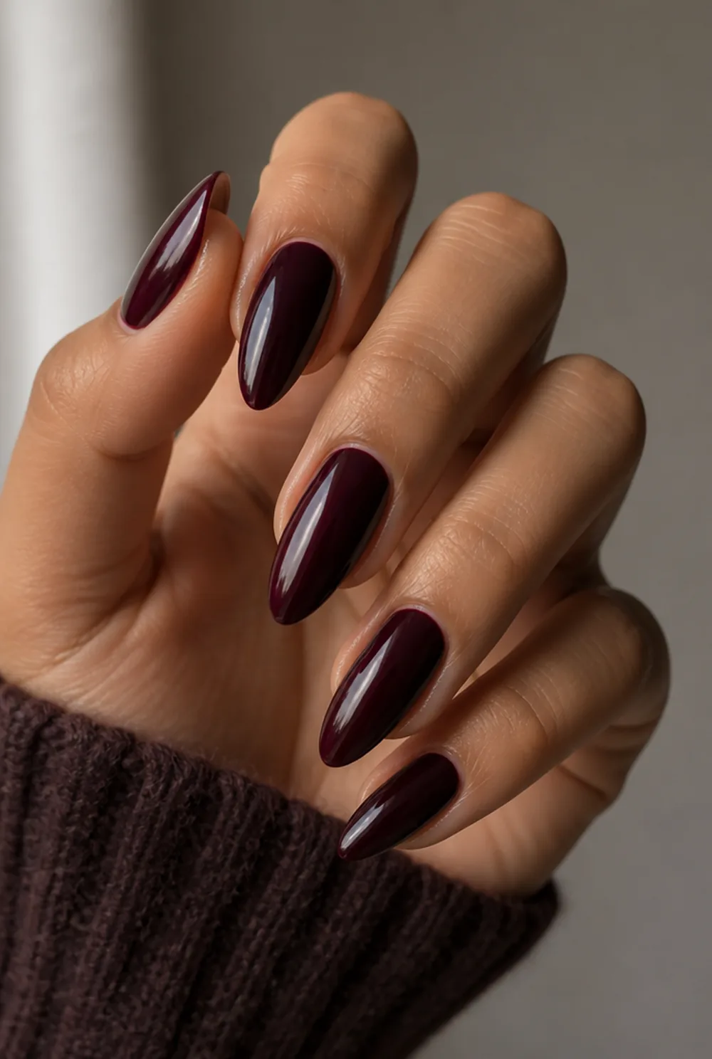 blackened cherry nail art on olive skin, long length