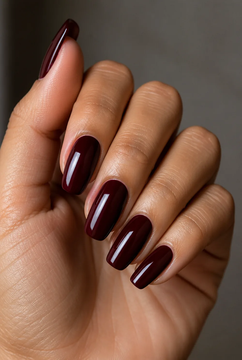 burgundy nail art on olive skin, long length