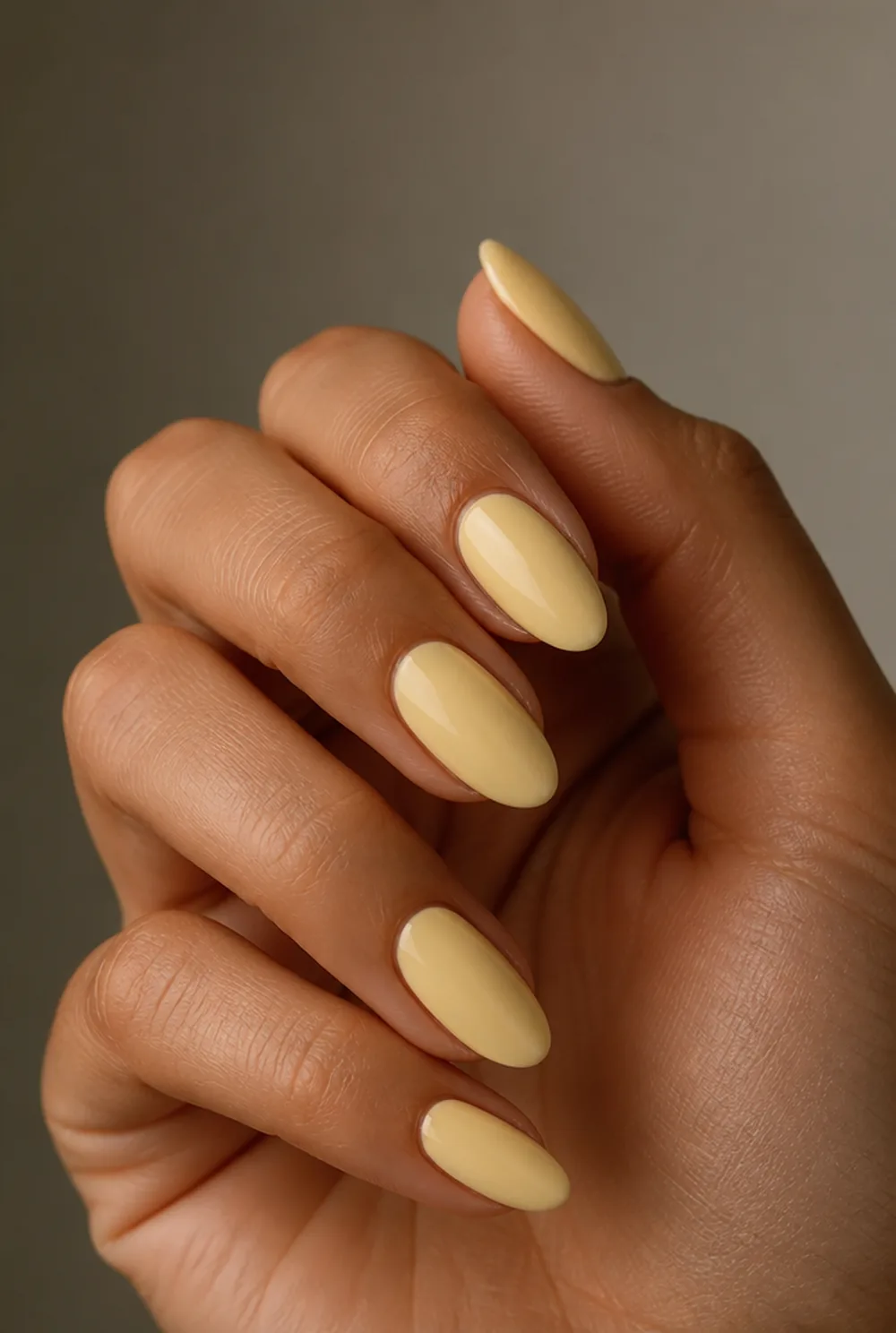 butter yellow nail art on olive skin, long length