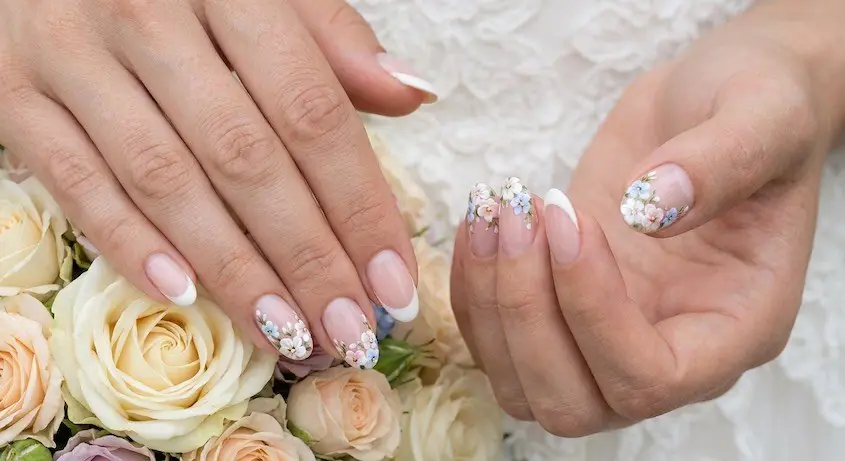 9wed - PolishedAndPrettyNails.com Floral French tip nails with small white flower accents beside a rose bouquet