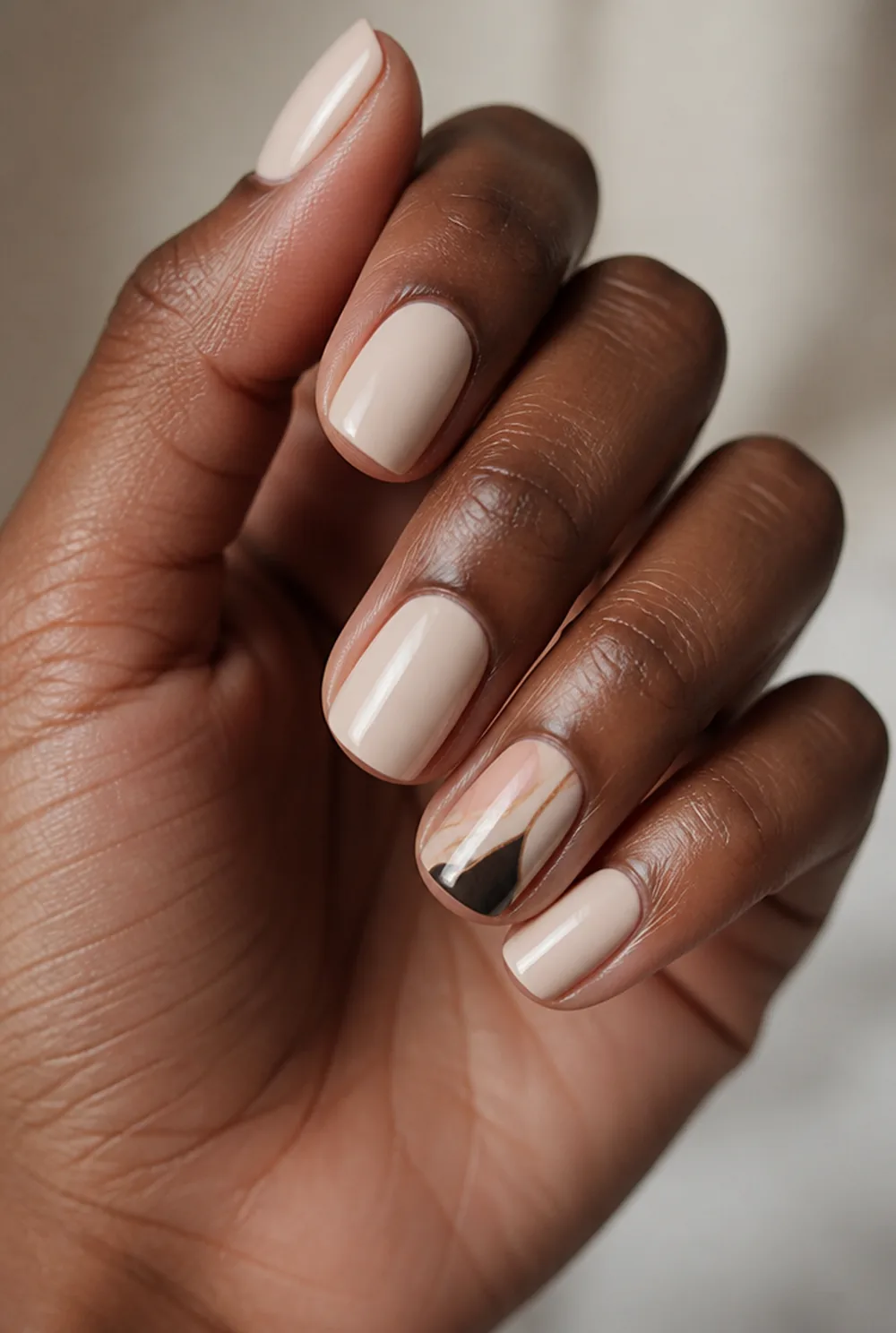 one accent nail nail art on deep brown skin