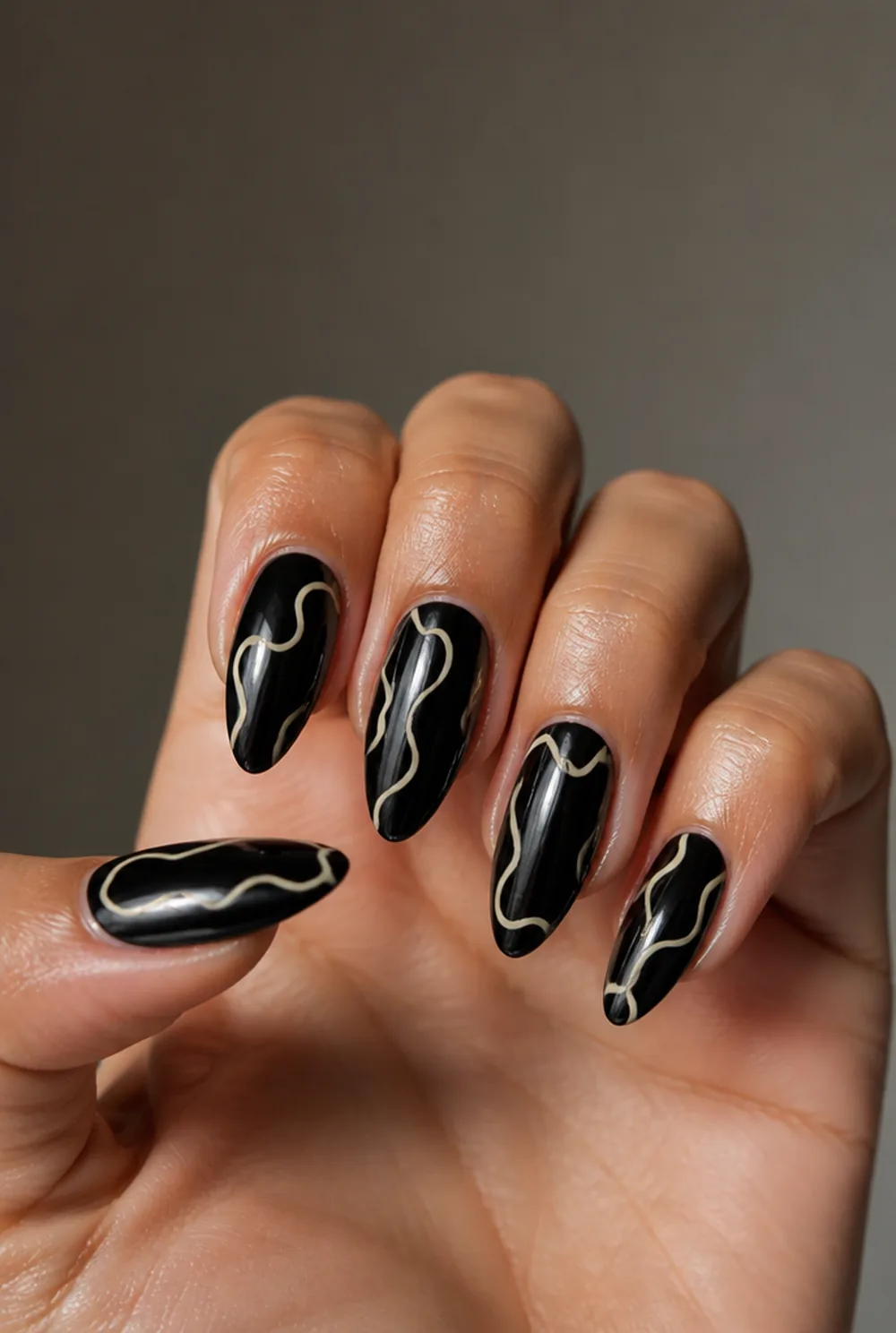 abstract on black nail art on olive skin, long length