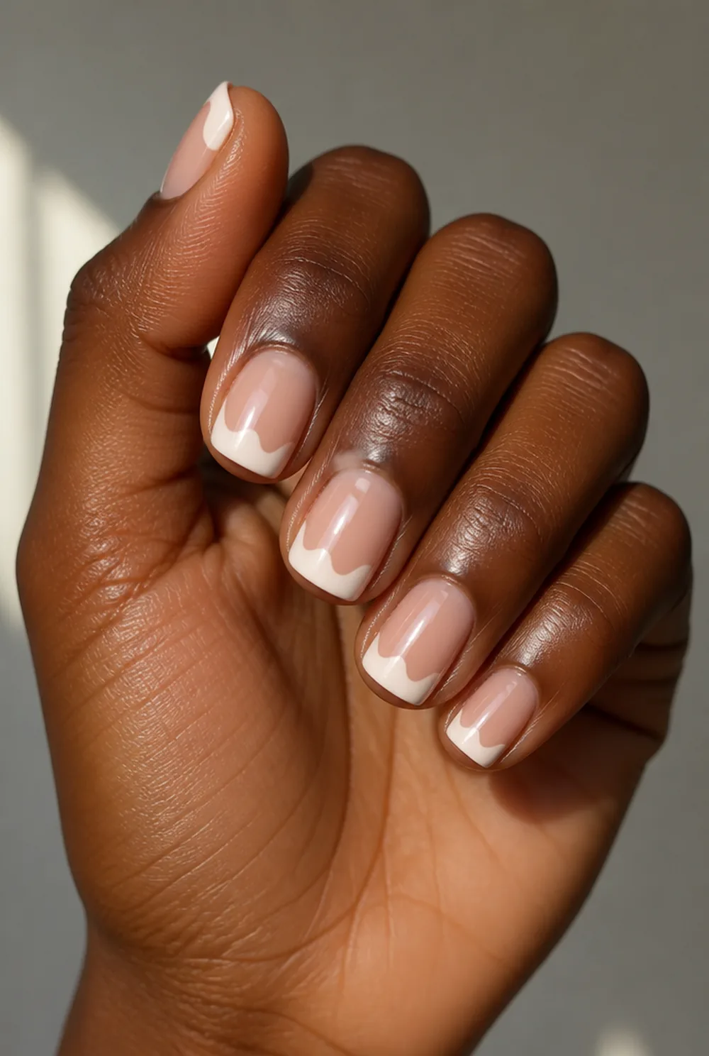 abstract french nail art on deep brown skin