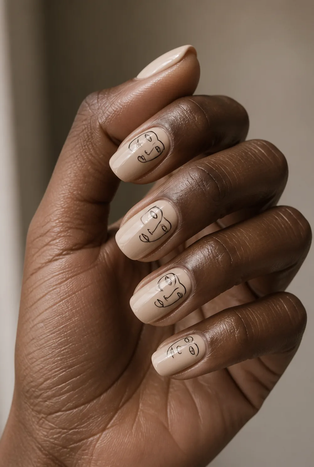 abstract face line art nail art on deep brown skin