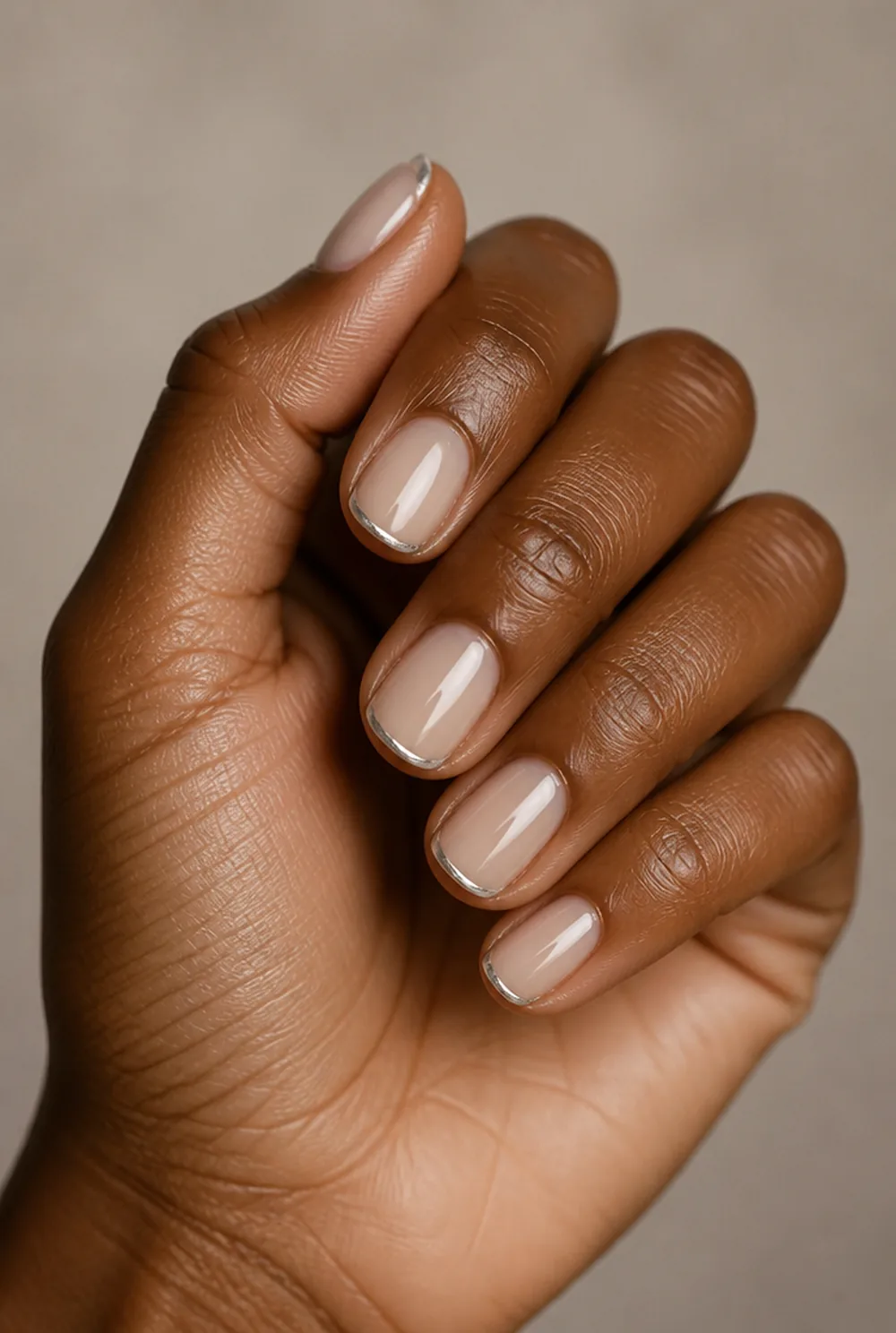 micro chrome french nail art on deep brown skin