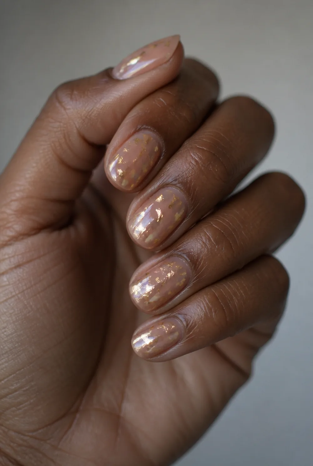 foil over jelly nail art on deep brown skin
