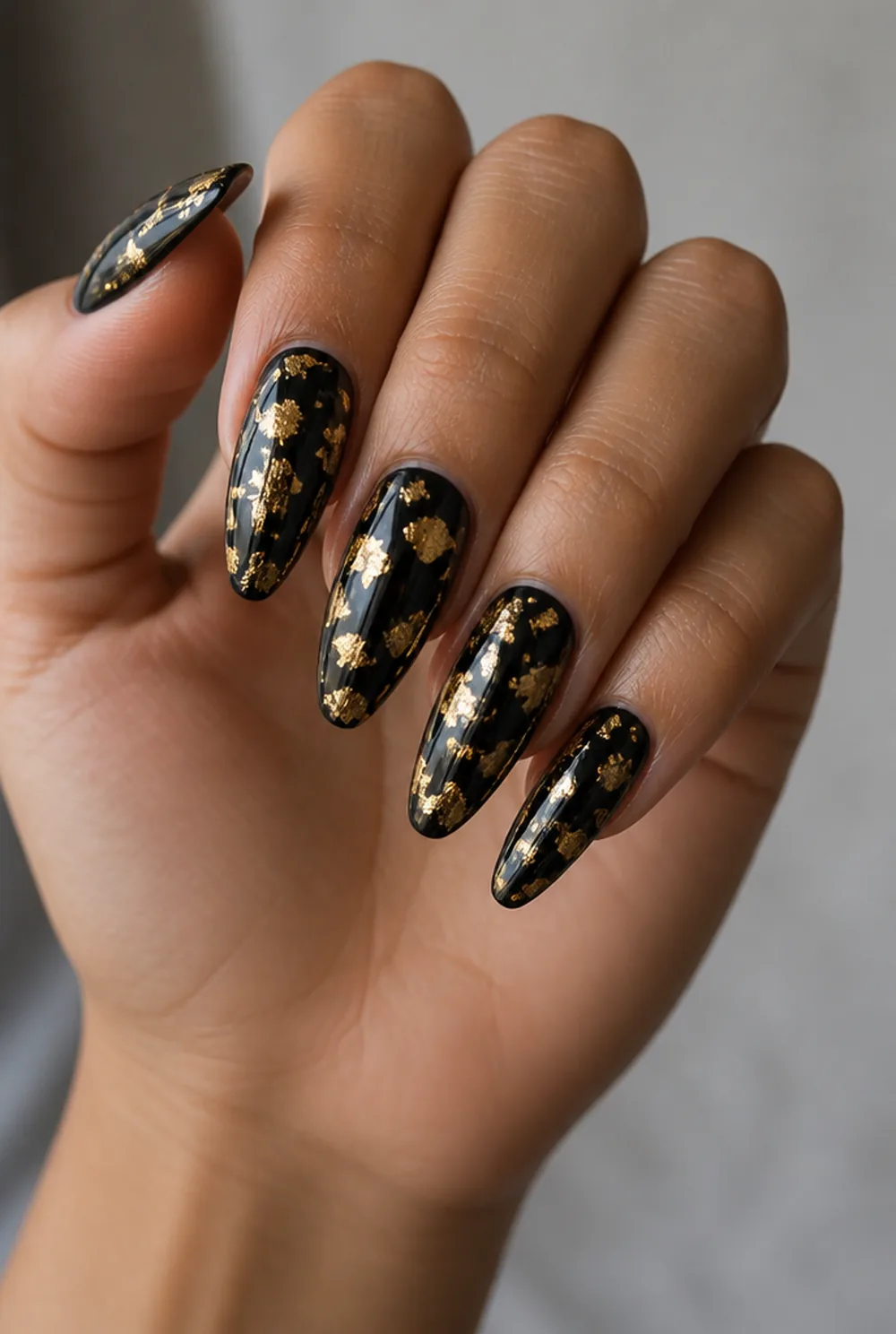 foil on black nail art on olive skin, long length