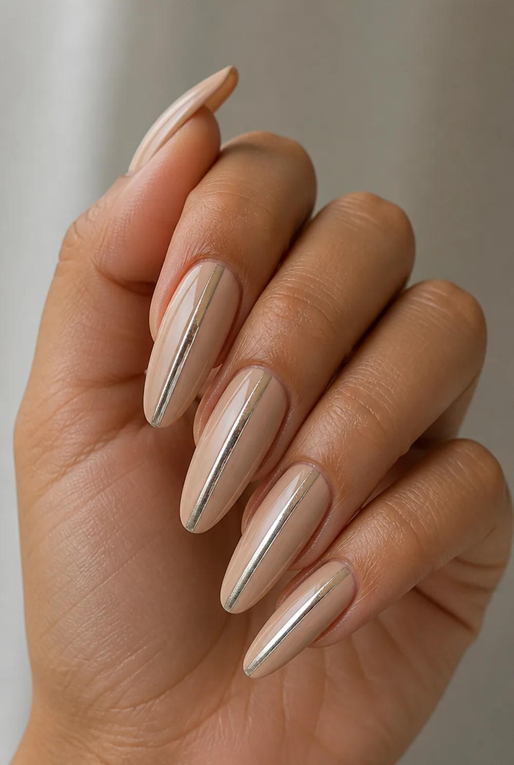 foil stripe nail art on olive skin, long length