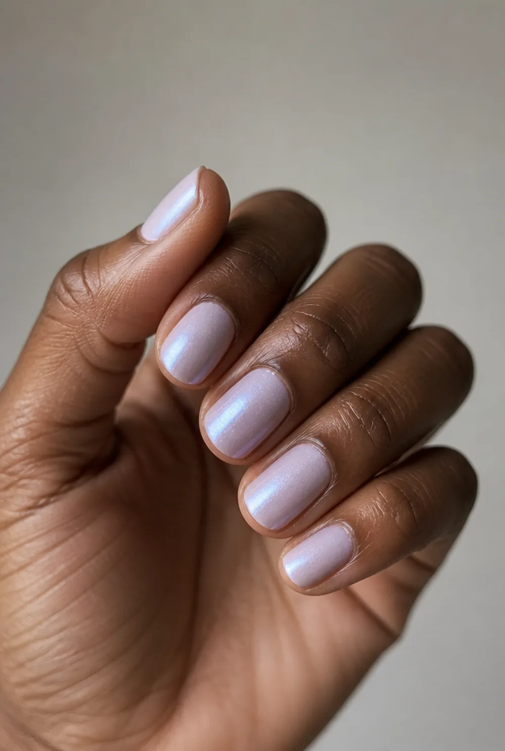 grey glazed pearl nail art on deep brown skin