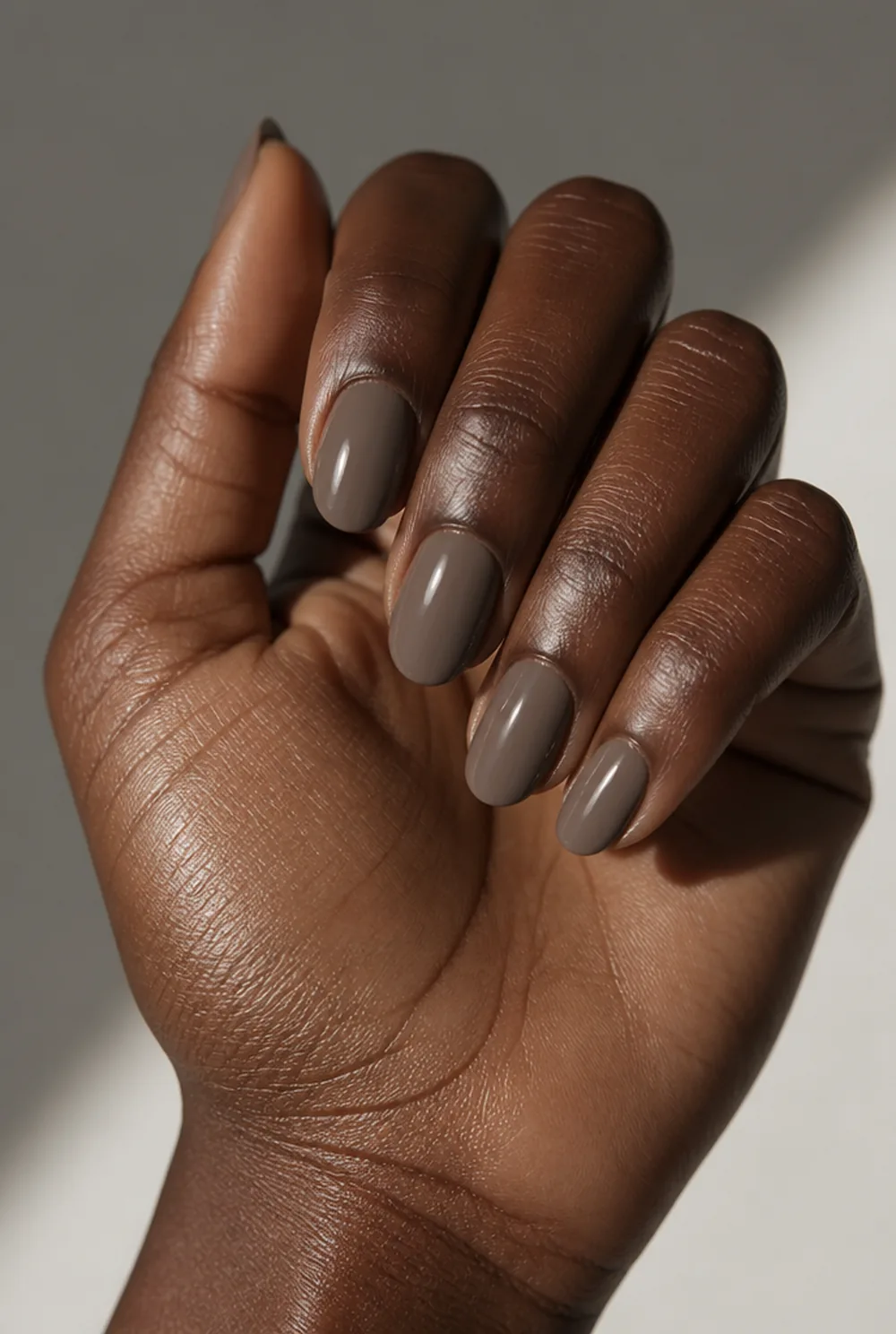 taupe grey nail art on deep brown skin
