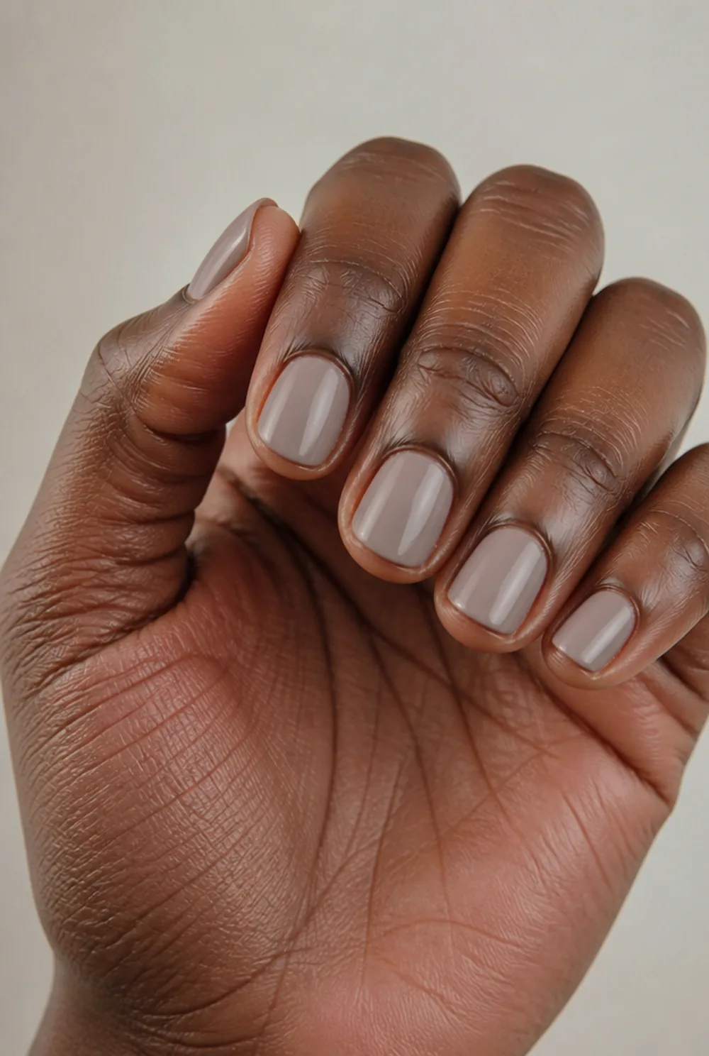 short greige squoval nail art on deep brown skin