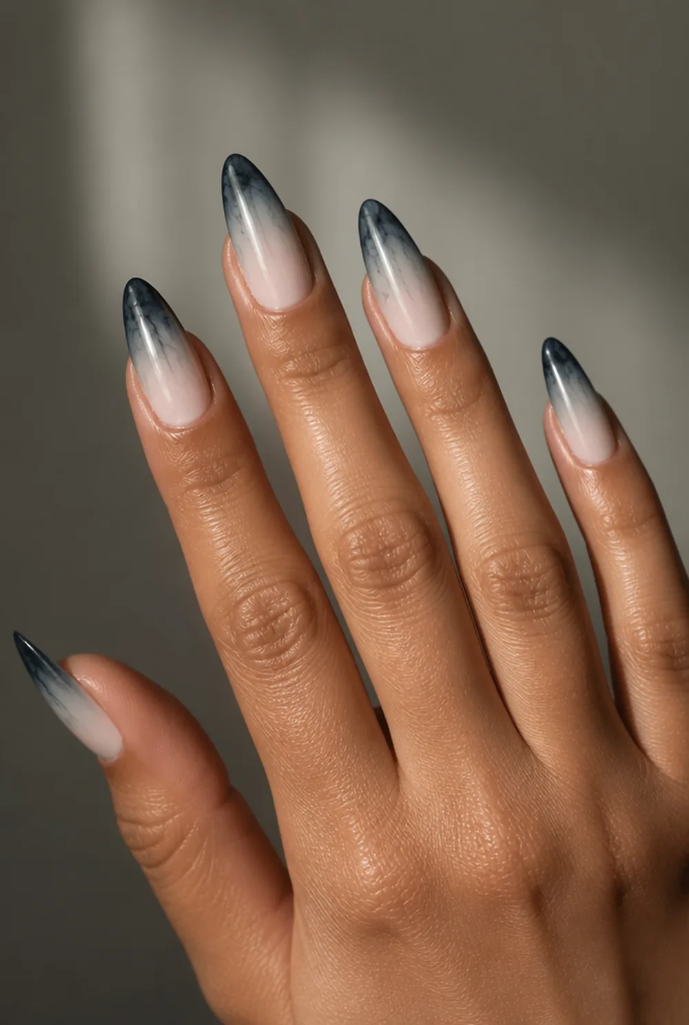 grey ombre nail art on olive skin, long length