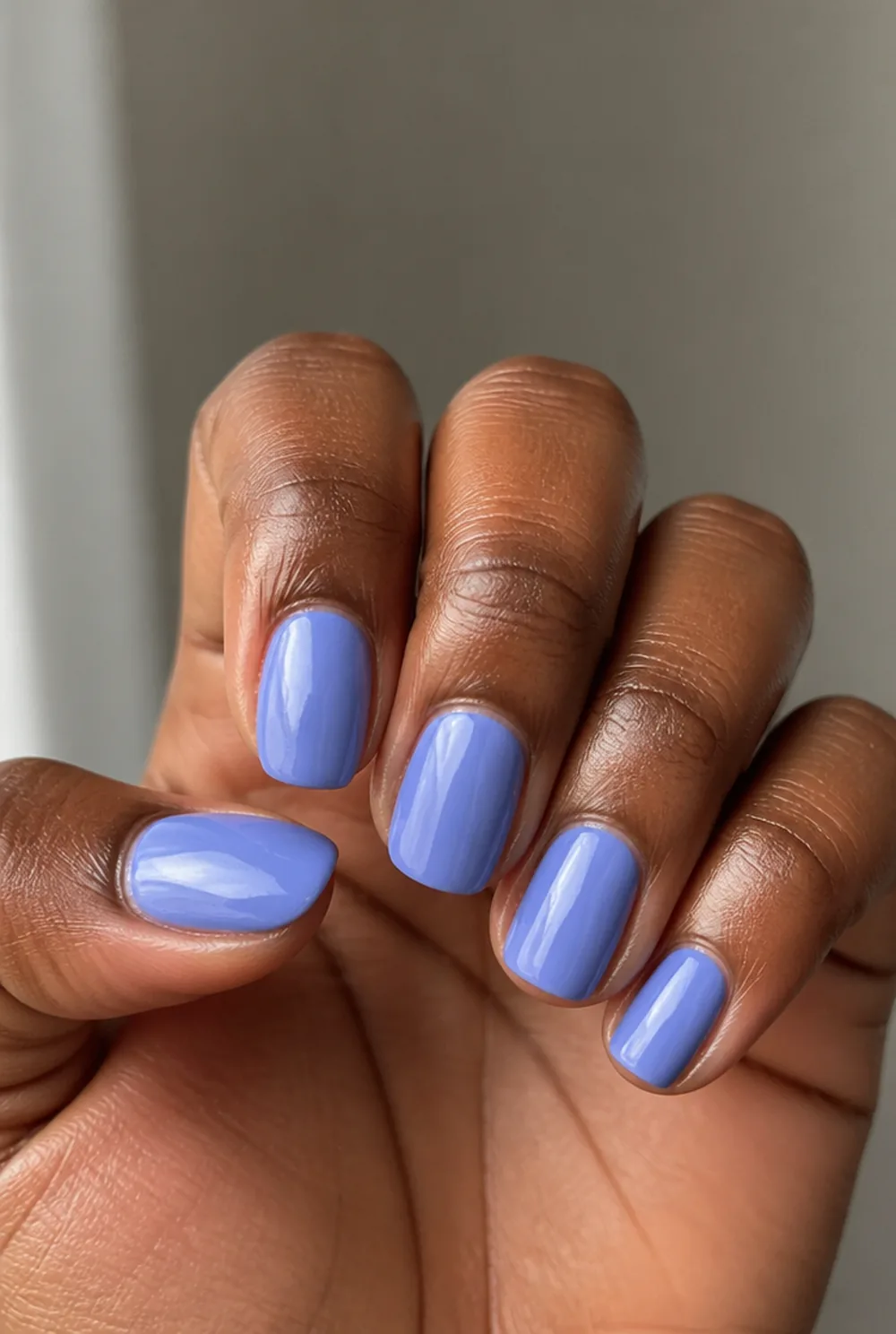 jelly blue nail art on deep brown skin