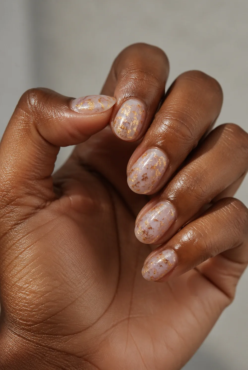 jelly with foil nail art on deep brown skin