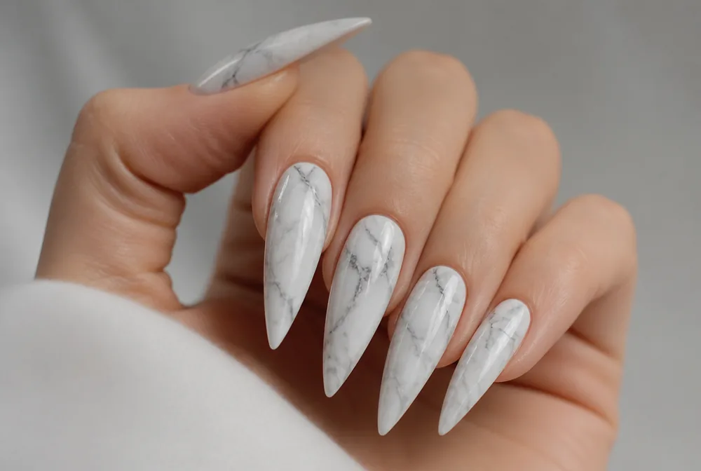 marble stiletto nails with gray veining