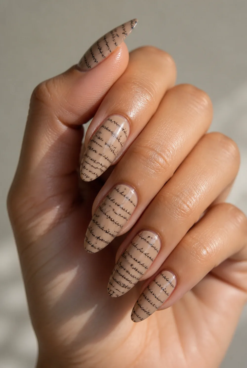 stamped text nails nail art on olive skin, long length