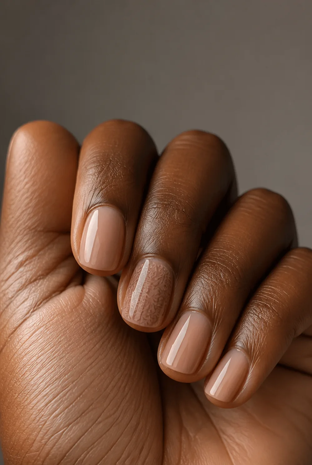 stamped accent nail nail art on deep brown skin