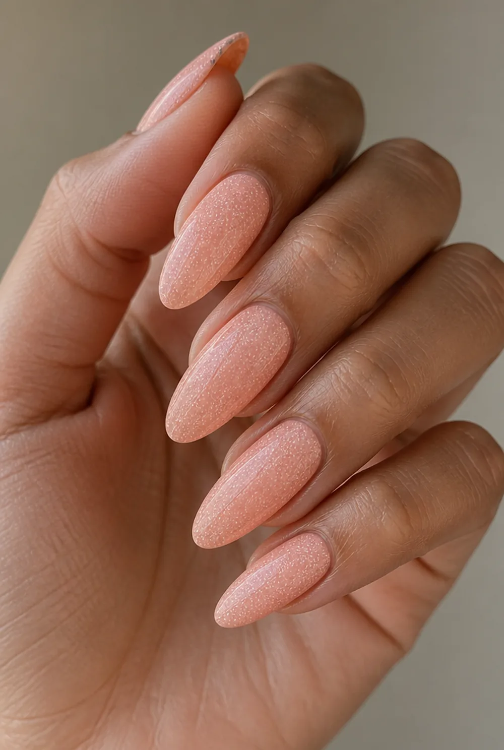 peach with tiny dots nail art on olive skin, long length