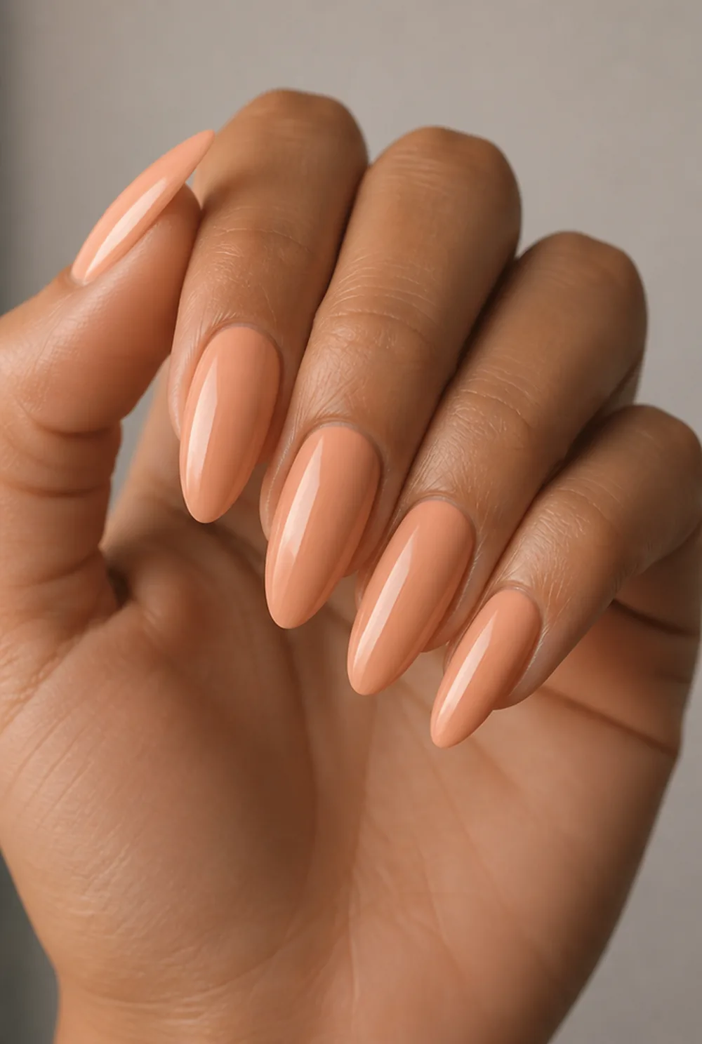 long peach almond nail art on olive skin, long length