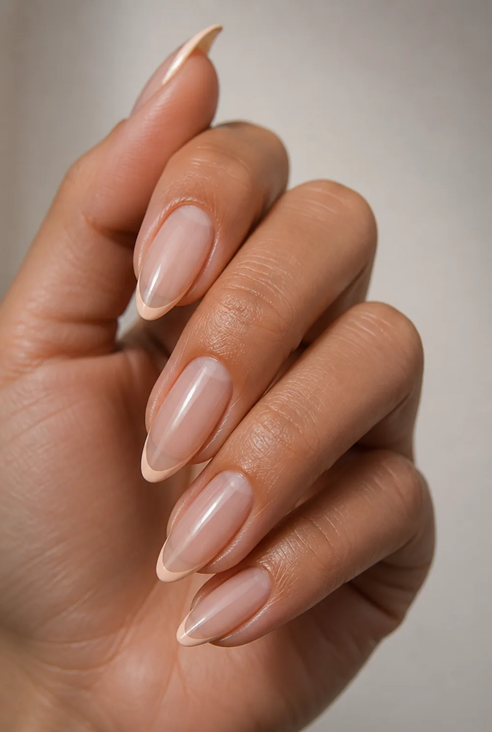 peach micro french nail art on olive skin, long length