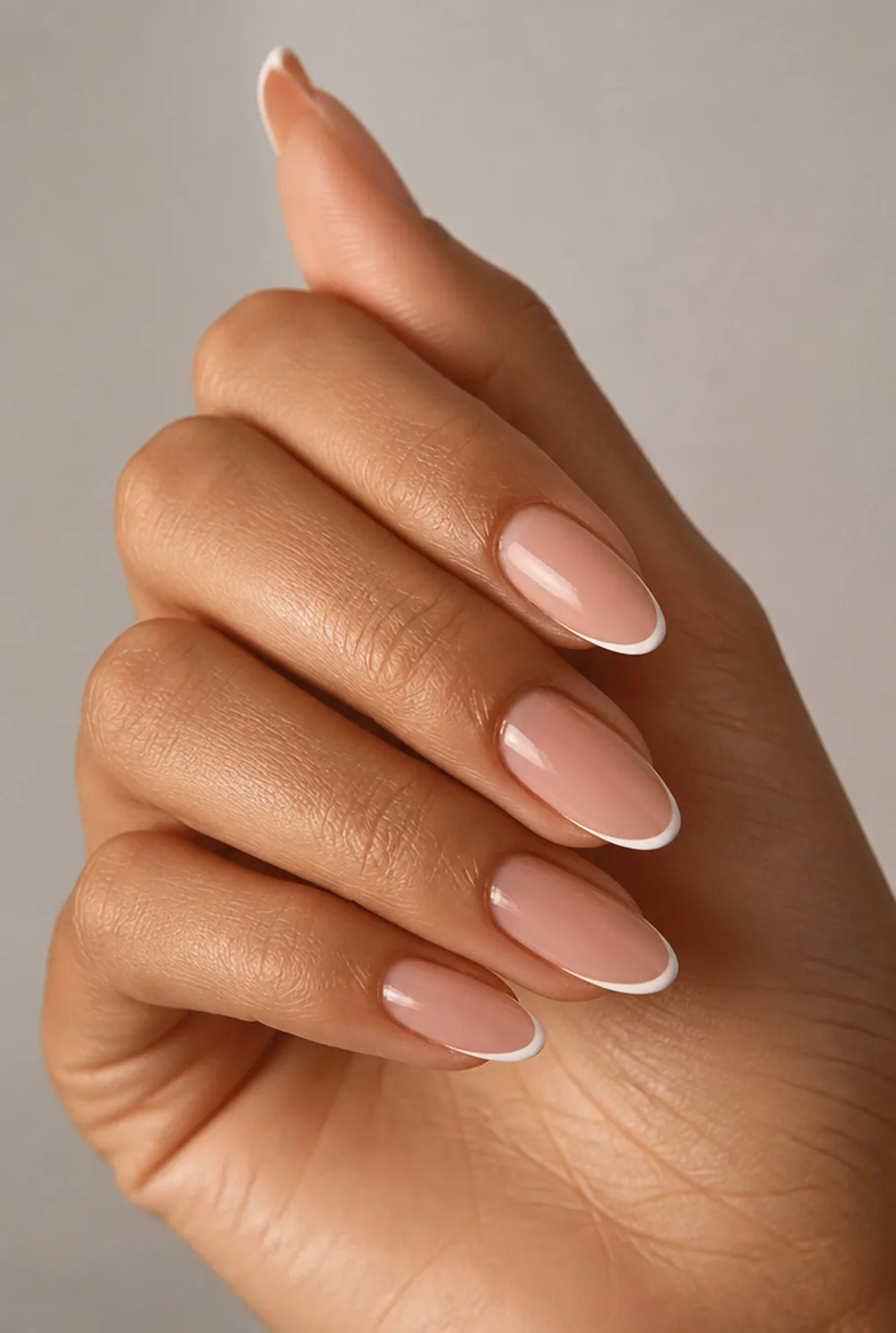 round french tip nail art on olive skin, long length
