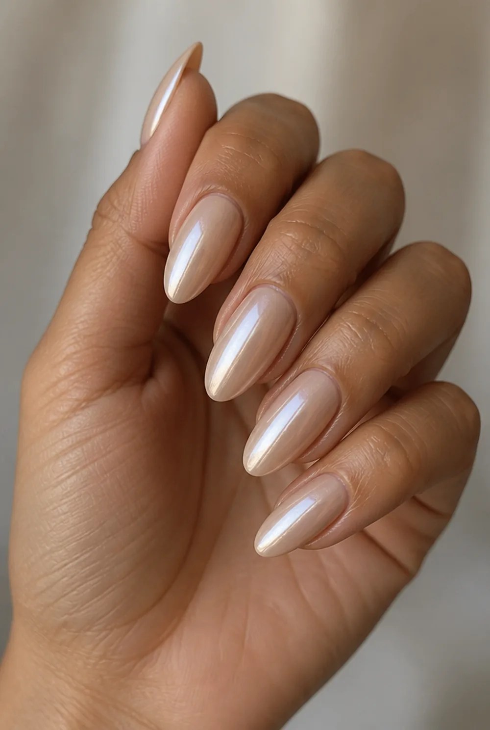 round chrome nail art on olive skin, long length