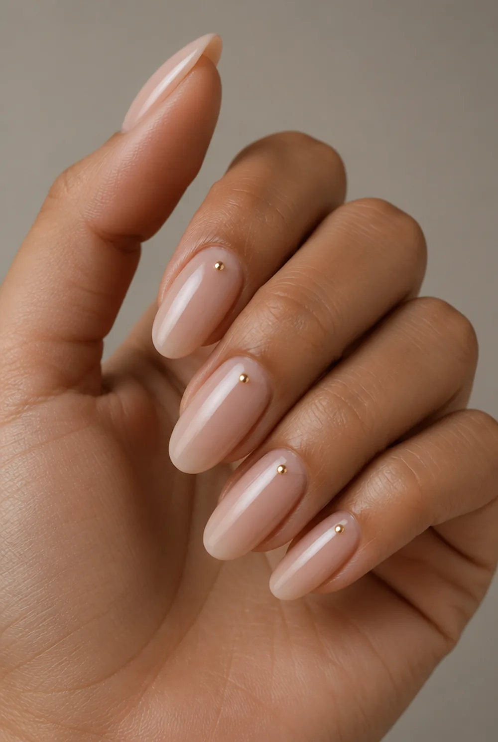 round with cuticle dot nail art on olive skin, long length