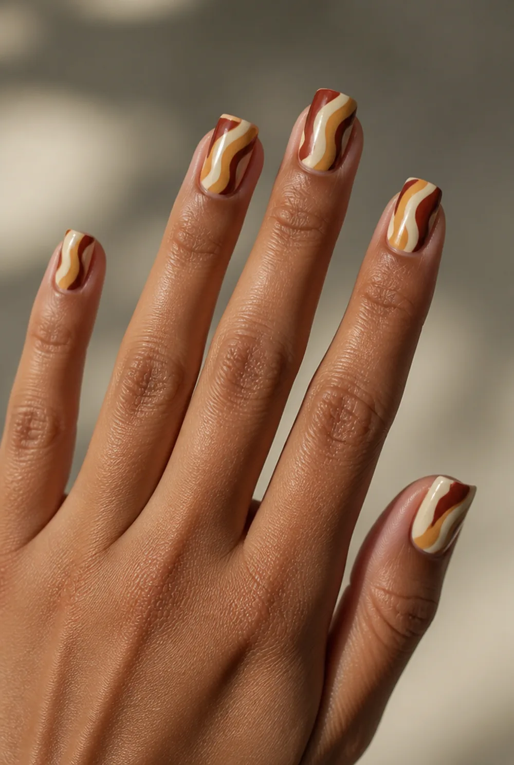 groovy seventies swirl nail art on olive skin, long length