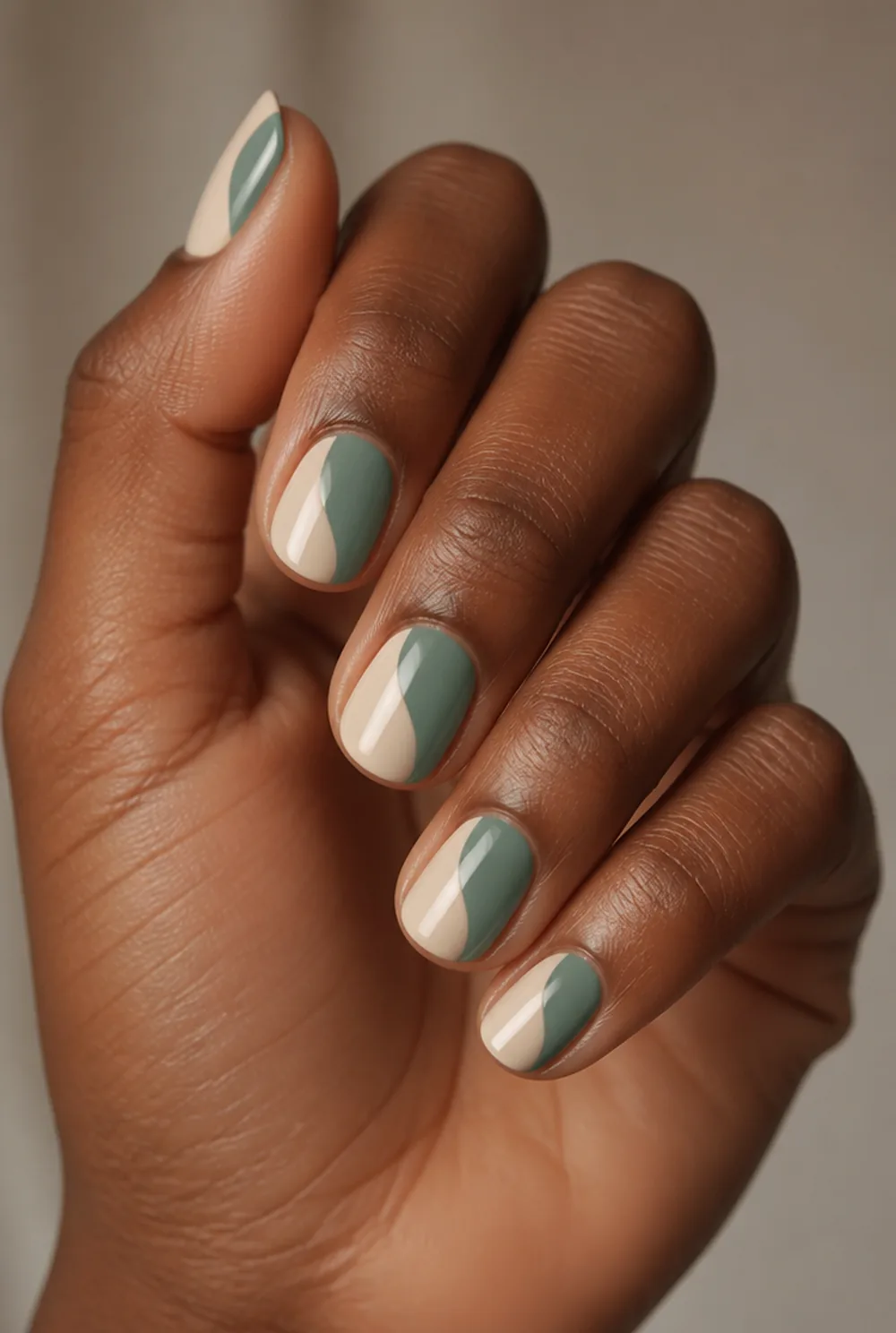 colour block swirl nail art on deep brown skin