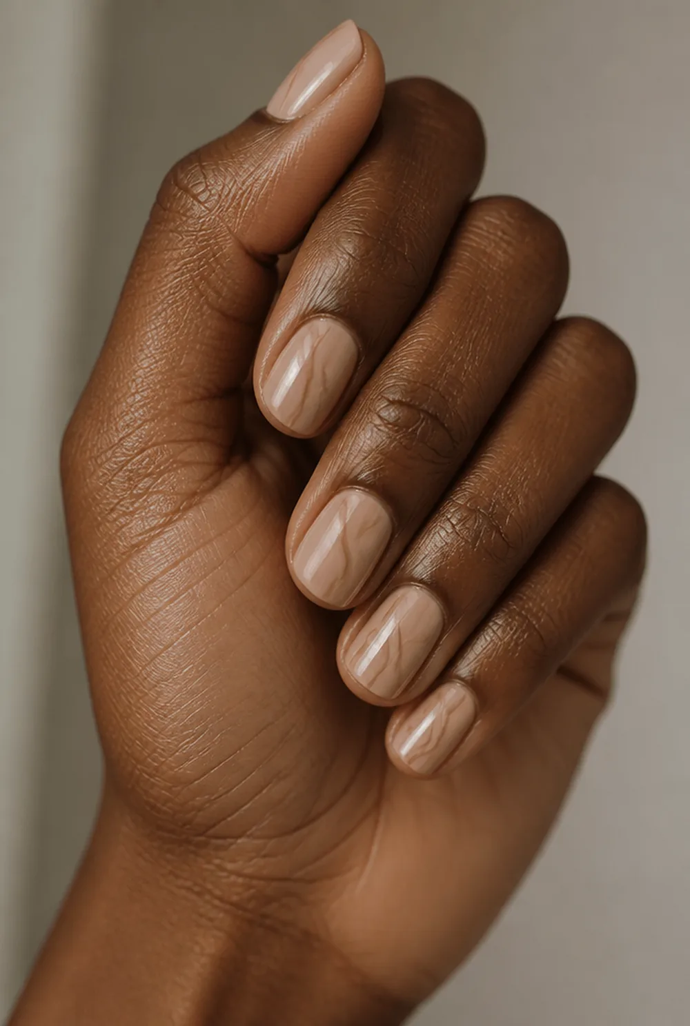 two-tone swirl nail art on deep brown skin