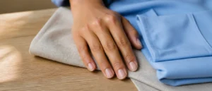 Very short, clean round natural nails with a sheer clear gloss, beside a folded pale blue - PolishedAndPrettyNails.com - PolishedAndPrettyNails.com Very short, clean round natural nails with a sheer clear gloss, beside a folded pale blue scrub top