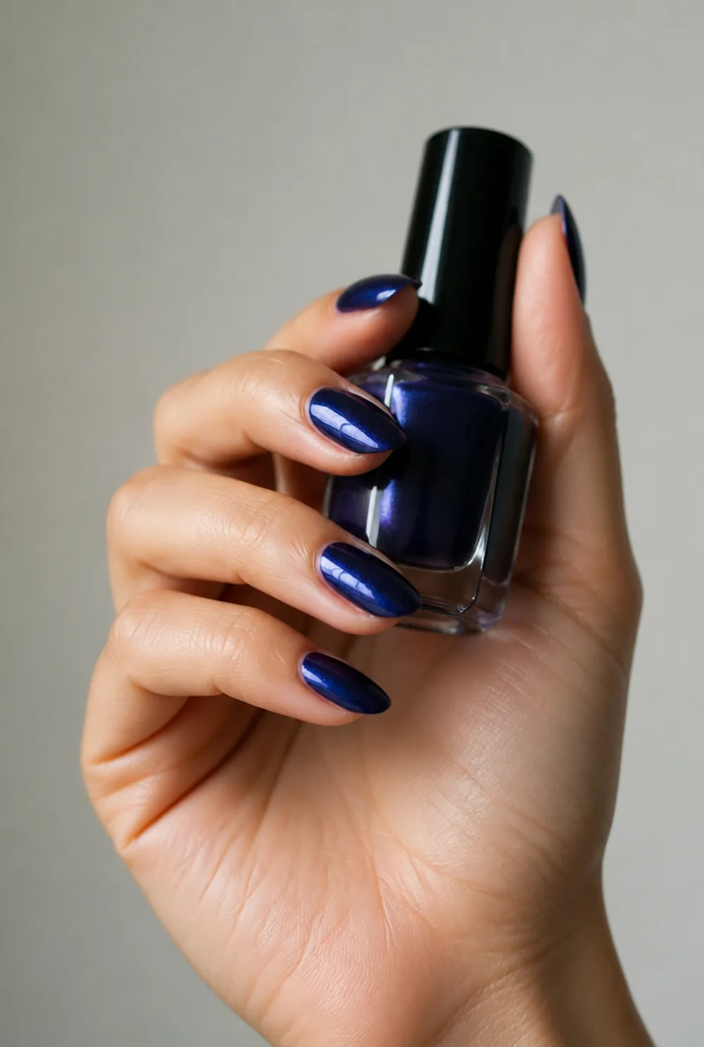 Sapphire jewel-tone nails on olive skin