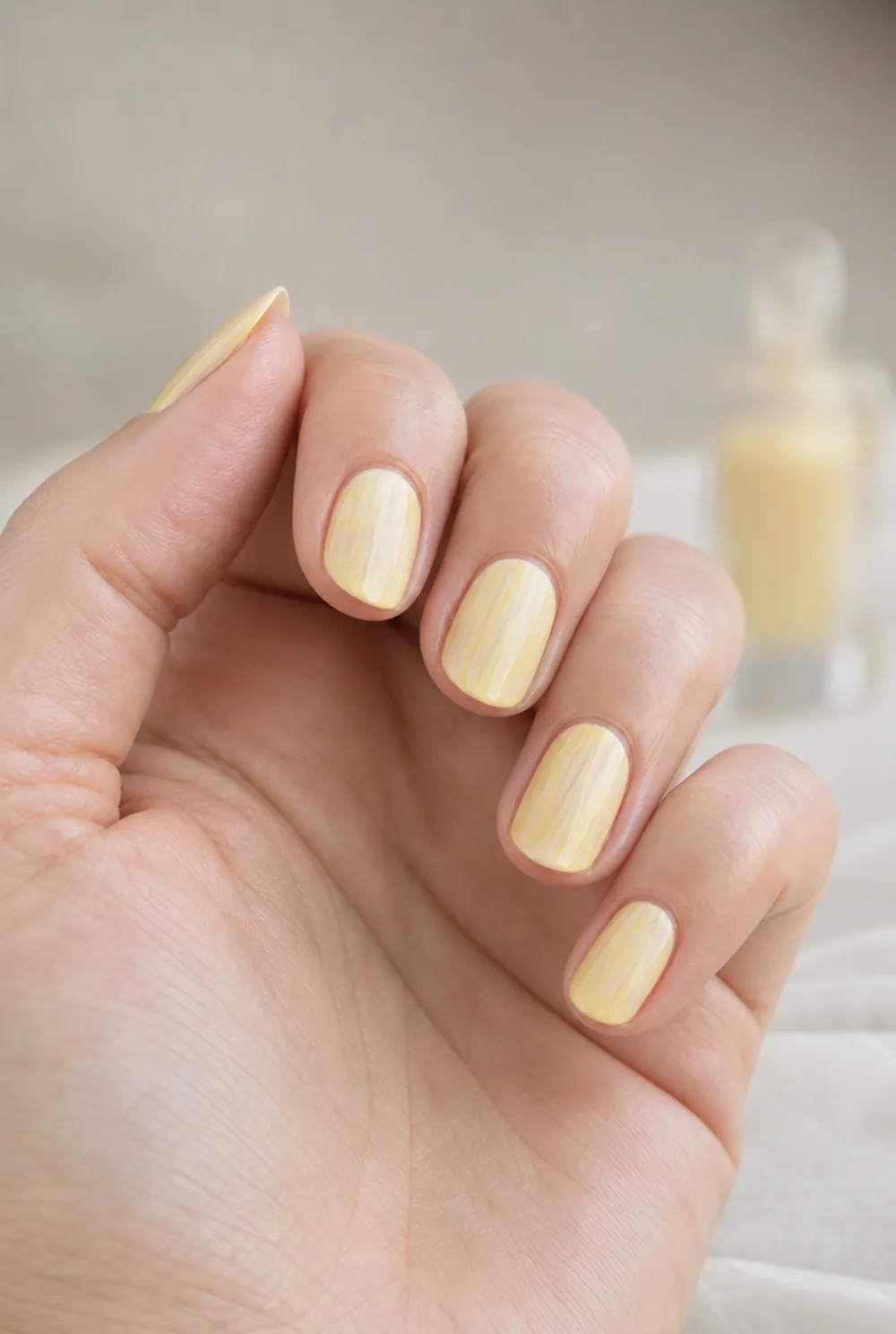 Streaky thin coat of pastel yellow polish - PolishedAndPrettyNails.com Streaky thin coat of pastel yellow polish